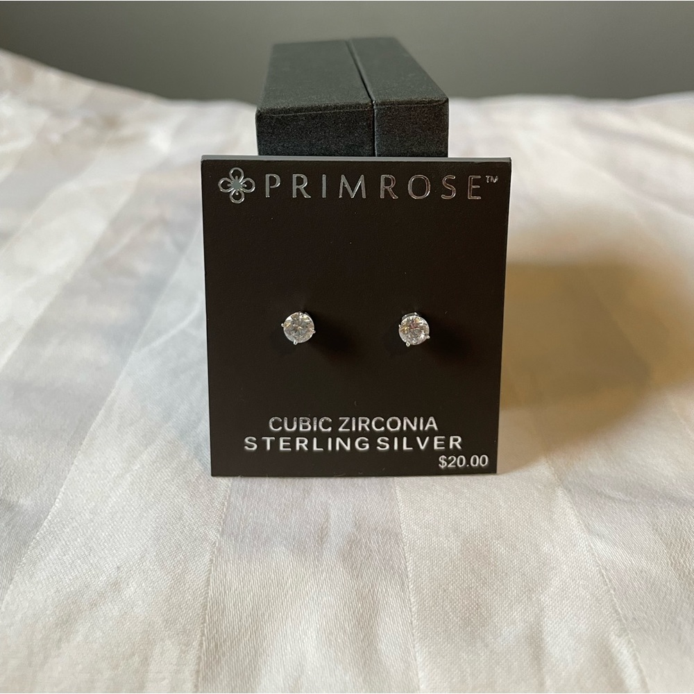 Sterling silver stud earrings, cubic zirconia setting.